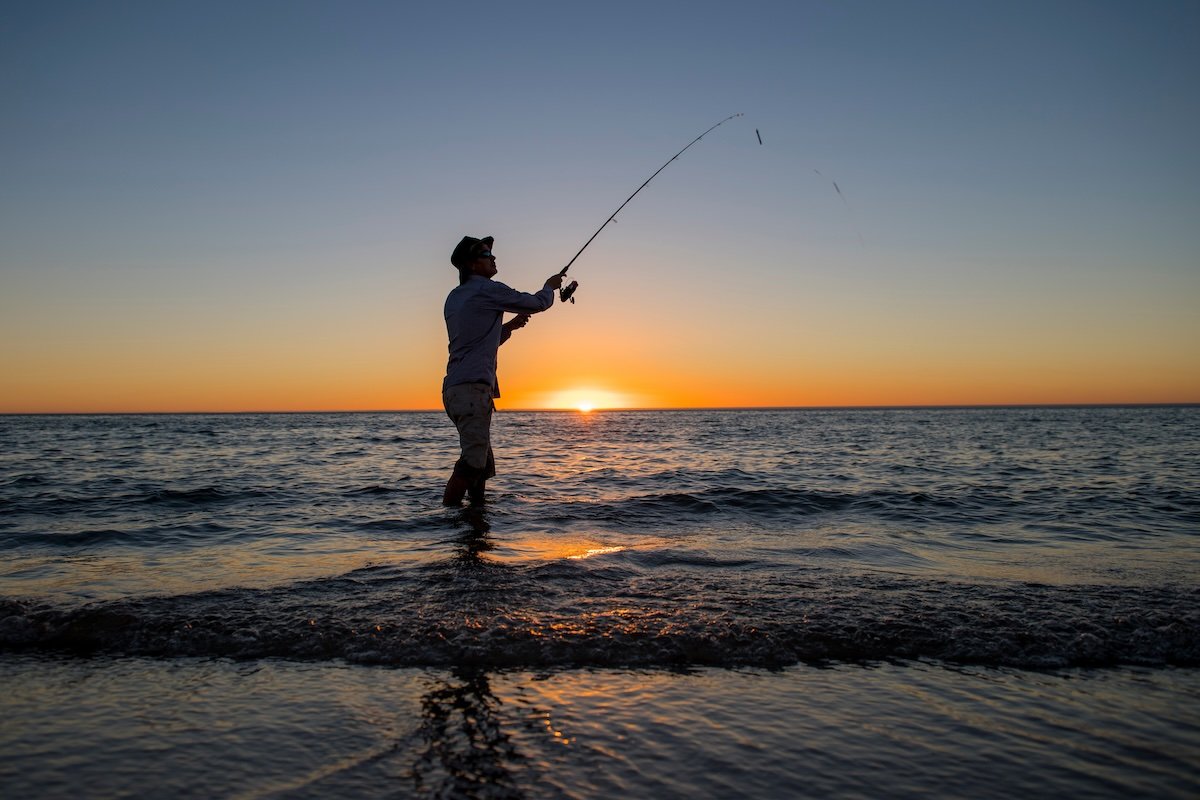 Fishing at sunrise sunset